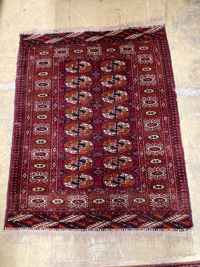 Two Bokhara rugs and a Turkish mat, largest 130 x 76cm